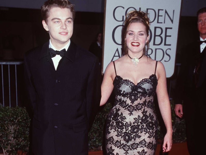 Leonardo DiCaprio and Kate Winslet, in a lace spaghetti-strap gown, attend the Golden Globe Awards at the Beverly Hilton Hotel in Los Angeles, California, on January 18, 1998. Getty Images