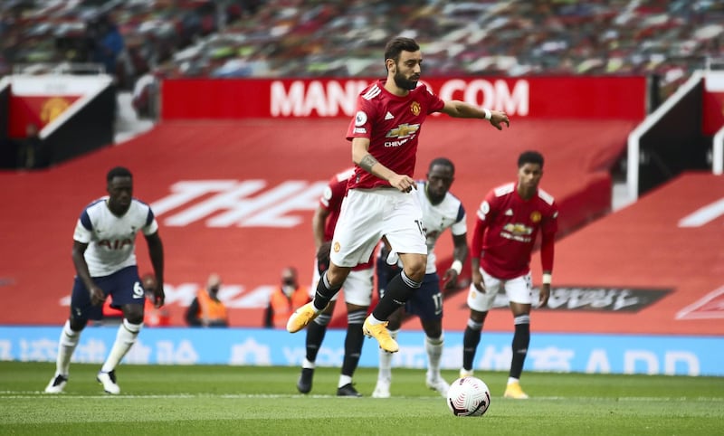MANCHESTER, ENGLAND - OCTOBER 04: Bruno Fernandes of Manchester United scores his sides first goal during the Premier League match between Manchester United and Tottenham Hotspur at Old Trafford on October 04, 2020 in Manchester, England. Sporting stadiums around the UK remain under strict restrictions due to the Coronavirus Pandemic as Government social distancing laws prohibit fans inside venues resulting in games being played behind closed doors. (Photo by Carl Recine - Pool/Getty Images)