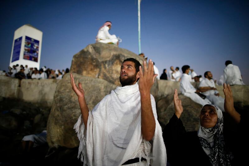 Muslim pilgrims join one of the Hajj rituals on Mount Arafat near Mecca early on September 11, 2016
Close to 1.5 million Muslims from around the world prepared on September 10 night for the climax of the annual hajj pilgrimage at a rocky hill known as Mount Arafat. The pilgrims will mark September 11 with day-long prayers and recitals of the Koran holy book at the spot in western Saudi Arabia where they believe their Prophet Mohammed gave his last hajj sermon. / AFP PHOTO / AHMAD GHARABLI