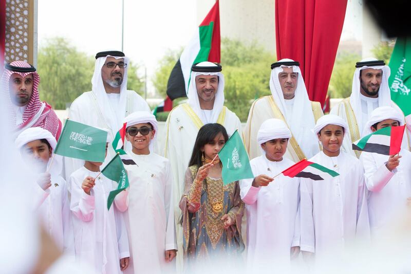 Abu Dhabi, United Arab Emirates - (L-R)  HH Sheikh Khaled bin Mohammed bin Zayed al Nahyan, HH Sheikh Hazza bin Zayed al Nahyan and HE Turkey Al Dakil, Ambassador of KSA to UAE with UAE officials and students at the renaming of the street in corniche, Abu Dhabi.  Leslie Pableo for The National for Haneen Dajani's story