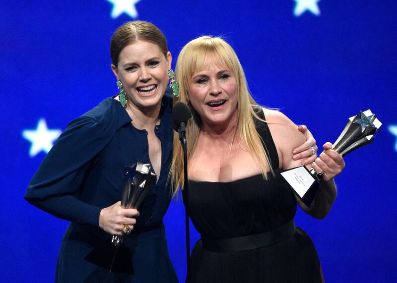 Amy Adams, left, and Patricia Arquette accept the award, a tie, for best actress in a limited series or movie made for television at the 24th annual Critics' Choice Awards on Sunday, Jan. 13, 2019, at the Barker Hangar in Santa Monica, Calif. Adams won for her role in "Sharp Objects" and Arquette won for her role in "Escape at Dannemora." (Photo by Chris Pizzello/Invision/AP)