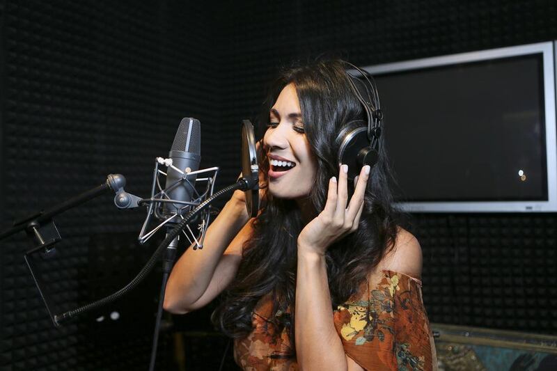 Clarita de Quiroz records at In the Mix Studios in Al Quoz, Dubai. Sarah Dea / The National 
