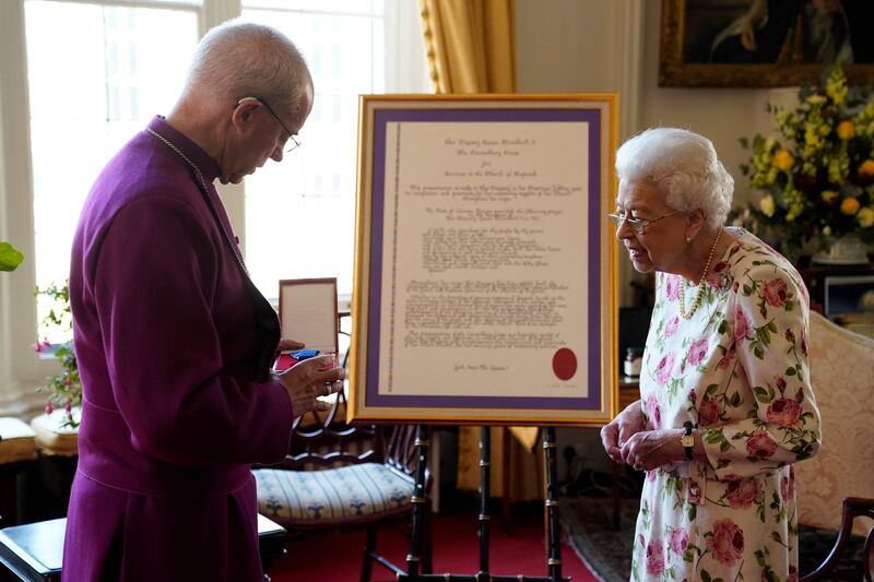 Queen Elizabeth II receives the Archbishop of Canterbury Justin Welby at Windsor Castle on Tuesday. He presented her with a special Canterbury Cross for service to the Church of England over 70 years. AFP