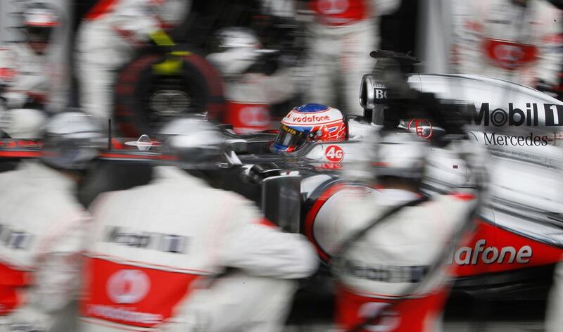 McLaren driver Jenson Button and other bigger drivers could find it difficult to keep hold of their rides after Formula One enacts new weight restrictions next season. Brandon Malone / AFP