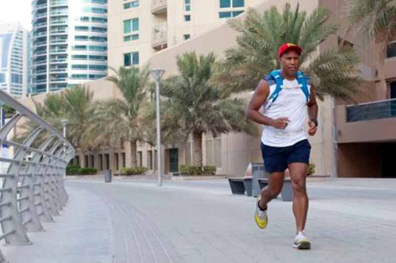 Dubai, United Arab Emirates, July 29, 2013:     Mark Henway, 46, from Australia trains for a 250km, 7 day race across the Sahara Desert in February along the Marina Walk in Dubai on July 29, 2013. Christopher Pike / The National

Reporter: Emily Cleland