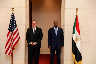A handout picture provided by Sudan's Foreign Media Council shows US Secretary of State Mike Pompeo (L) posing for a picture with Sudan's Sovereign Council chief General Abdel Fattah al-Burhan in Khartoum on August 25, 2020. Pompeo is on an official visit to Sudan to urge more Arab countries to normalise ties with Israel, following the US-brokered Israel-UAE agreement. He is the first American top diplomat to visit Sudan since Condoleezza Rice went in 2005.
 - === RESTRICTED TO EDITORIAL USE - MANDATORY CREDIT "AFP PHOTO / HO / SUDAN FOREIGN MEDIA COUNCIL" - NO MARKETING - NO ADVERTISING CAMPAIGNS - DISTRIBUTED AS A SERVICE TO CLIENTS ===
 / AFP / Sudan's Foreign Media Council / Handout / === RESTRICTED TO EDITORIAL USE - MANDATORY CREDIT "AFP PHOTO / HO / SUDAN FOREIGN MEDIA COUNCIL" - NO MARKETING - NO ADVERTISING CAMPAIGNS - DISTRIBUTED AS A SERVICE TO CLIENTS ===
