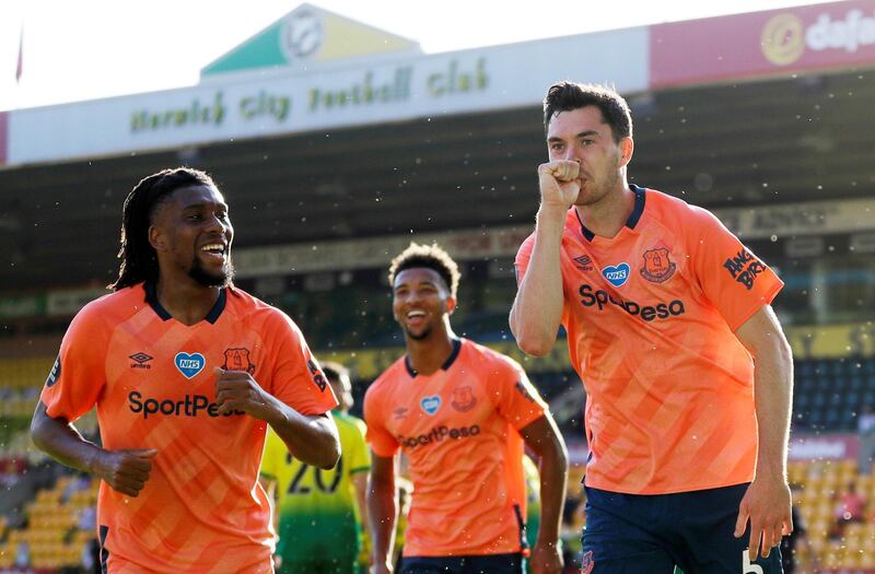 Everton's Michael Keane, right, celebrates scoring the winner at Carrow Road. Reuters