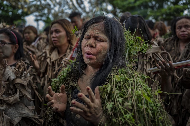 Devotees covered in mud and dried banana leaves take part in the Taong Putik ("mud people") Festival  in the village of Bibiclat in Aliaga town, Nueva Ecija province, Philippines. Each year, the residents of Bibiclat village in Aliaga town celebrate the Feast of Saint John by covering themselves in mud, dried banana leaves, vines, and twigs as part of a little-known Catholic festival. Getty Images