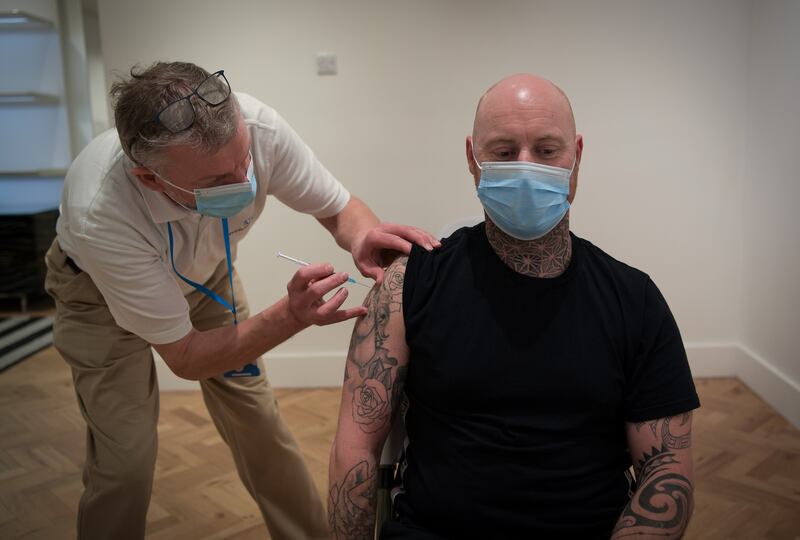 A man gets vaccinated at an NHS Trust pop-up vaccination clinic. Getty