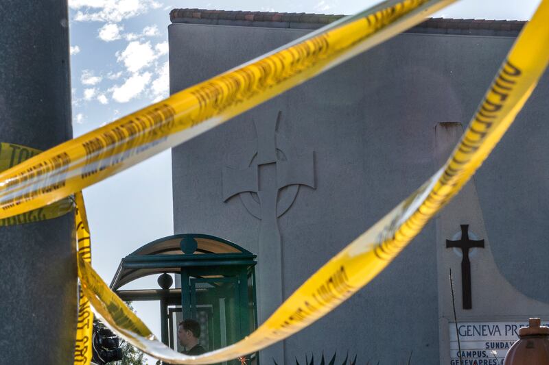 Crime scene tape is stretched across the exterior of the Geneva Presbyterian Church in Laguna Woods, Calif. , Sunday, May 15, 2022, after a fatal shooting.   (AP Photo / Damian Dovarganes)