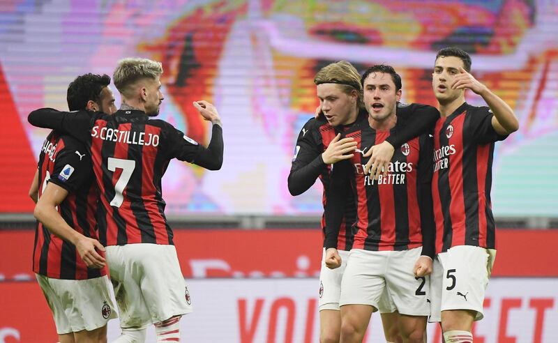 Milan's Davide Calabria, second right, celebrates scoring their first goal with teammates. Reuters