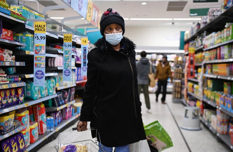 A shopper at a Morrisons supermarket in London. EPA