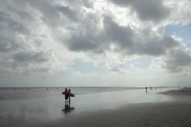 The black beaches of Seminyak, Bali, make for difficult surfing, but offer a rest for the weary acupressure patient after a day's session. (Photo by Effie-Michelle Metallidis)