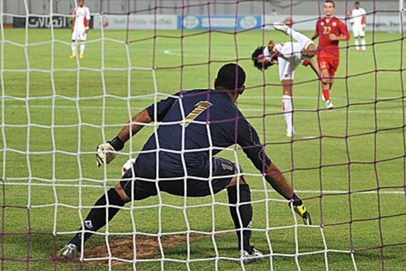 UAE  midfielder Theyab Awana scores an audacious penalty against Lebanon in a friendly match in July.