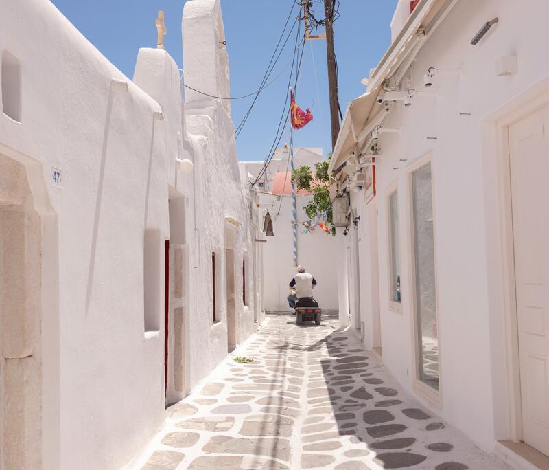An empty street in the old town in Mykonos, Greece, on Monday, May 10, 2021. Loulou D'Aki/Bloomberg
