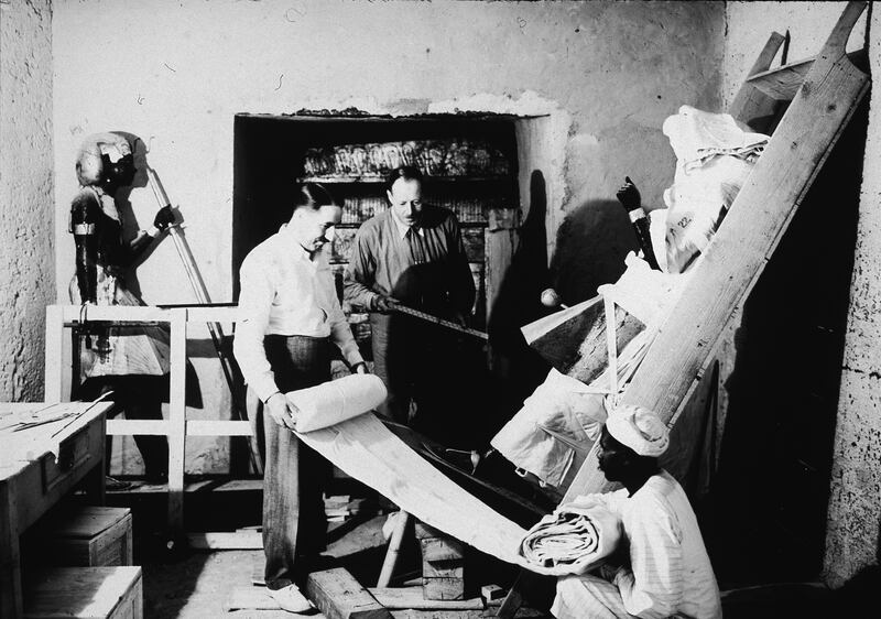 Howard Carter, right, and archaeologist Arthur Callender remove objects from the antechamber of the tomb of Tutankhamun, in 1923.
