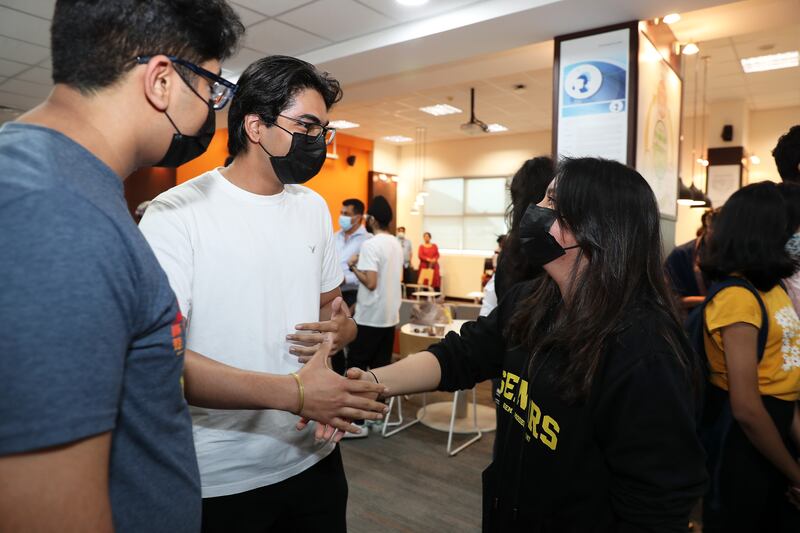 Pupils congratulate each other at Gems Modern Academy.