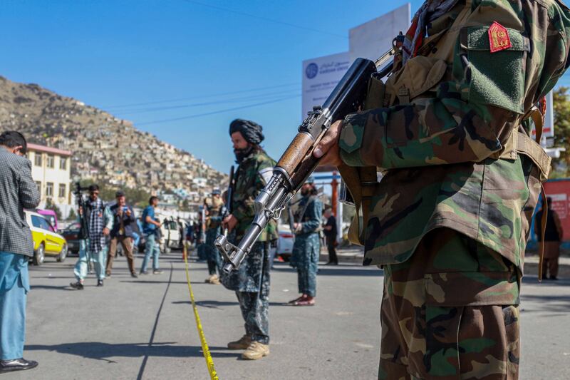 Taliban fighters at the scene of a bomb blast in Kabul, Afghanistan, in October 2021. EPA