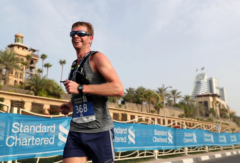 Dubai, United Arab Emirates - January 25, 2019: People run in the Standard Chartered Dubai Marathon 2019. Friday, January 25th, 2019 at Jumeirah, Dubai. Chris Whiteoak/The National