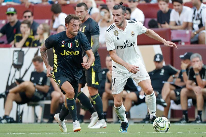 Real Madrid's Gareth Bale dribbles the ball past Juventus' Claudio Marchisio. Reuters