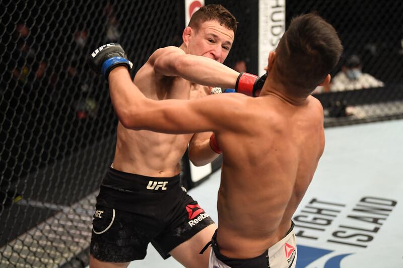 Kai Kara France punches Brandon Royval in their flyweight bout during UFC 253 in Abu Dhabi. Josh Hedges / Zuffa LLC