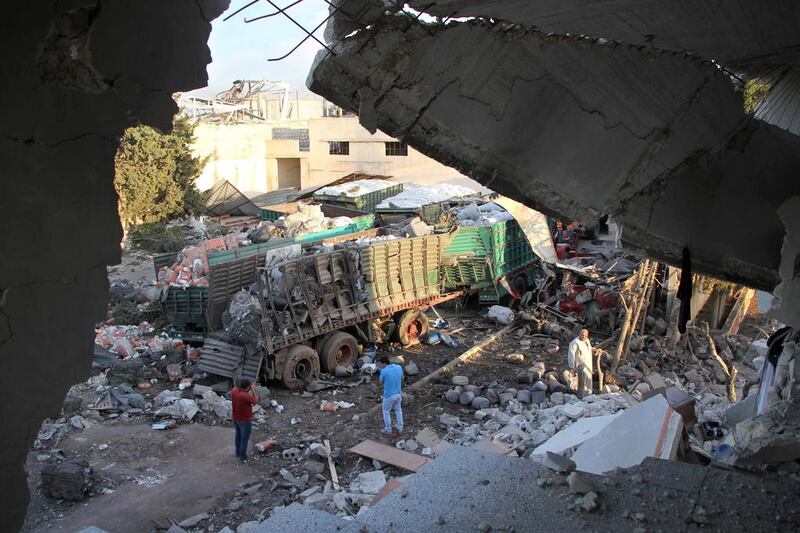 Aid is strewn across the floor in the town of Orum al-Kubra on the western outskirts of Aleppo after a deadly air strike (AFP / Omar Haj Kadour)