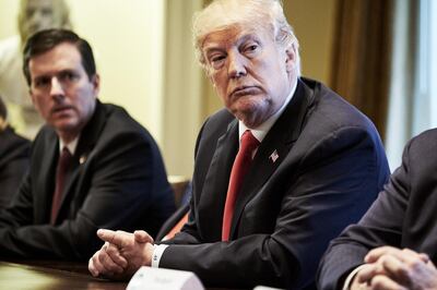 U.S. President Donald Trump, right, listens during a meeting with steel and aluminum executives in the Cabinet Room of the White House in Washington, D.C., U.S., on Thursday, March 1, 2018. Trump said the U.S. will slap tariffs on steel and aluminum imports to protect national security, a major escalation of his hawkish trade agenda that could hit producers from Europe to Asia and spur global retaliation. Photographer: T.J. Kirkpatrick/ Bloomberg