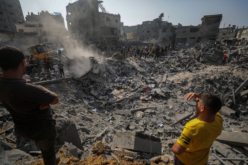 Palestinians search for bodies and survivors among the rubble after Israeli air strikes in Jabalia, northern Gaza, on Wednesday. EPA
