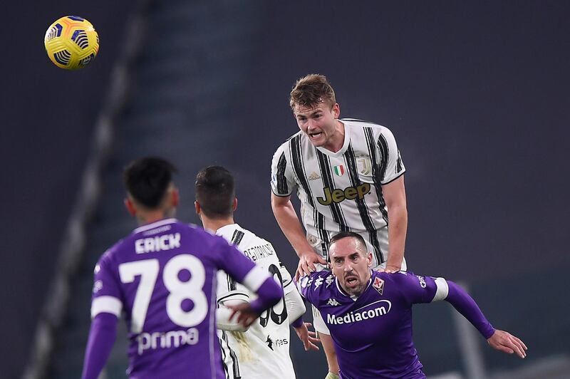 Juventus' Matthijs de Ligt leaps to win a header against Fiorentina. AP