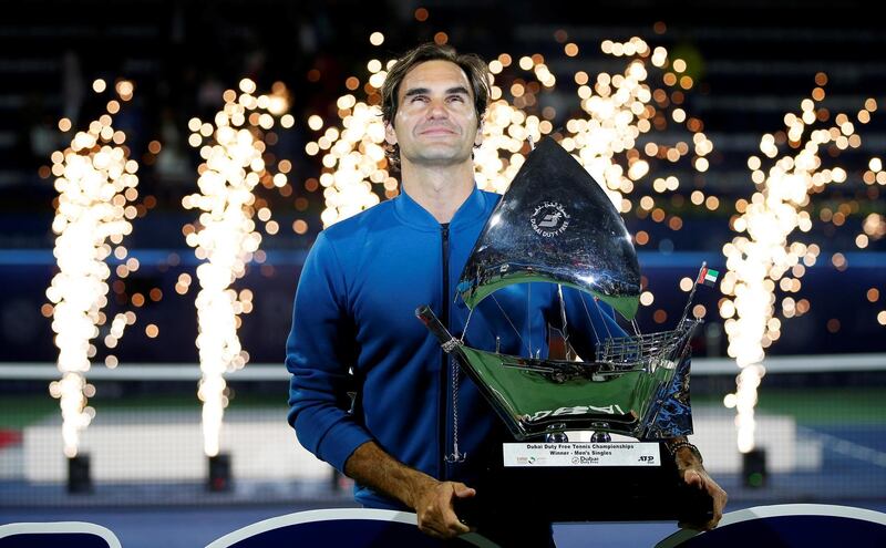 epa07409160 Roger Federer of Switzerland poses with his trophy after defeating Stefanos Tsitsipas of Greece in their final match at the Dubai Duty Free Tennis ATP Championships 2019 in Dubai, United Arab Emirates, 02 March 2019.  EPA/ALI HAIDER