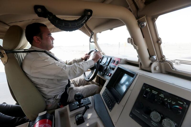 Ali Hassan Al Balooshi, technical test driver, drives a NIMR special operations vehicle. Christopher Pike / The National