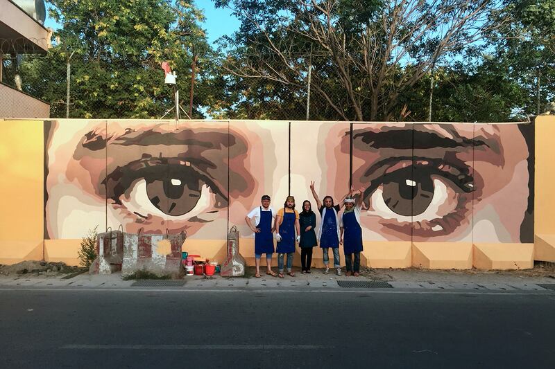 Pictured: ArtLords' first mural 'I see you' in Kabul with co-founders Omaid Sharifi and Kabir Mokamel, putting a spotlight on huge corruption issues that blight Afghanistan. 
Photo provided by ArtLords.