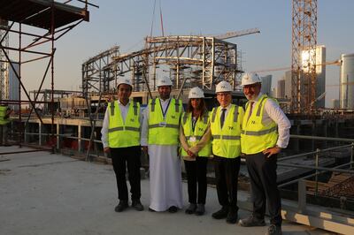 The Al Farwaniya Property Developers team outside the semi-constructed snow park structure within Reem Mall