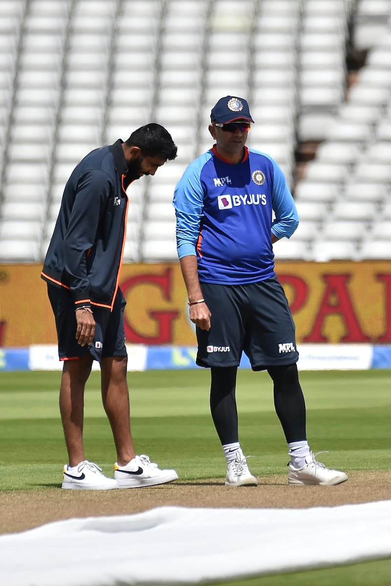 India's Jasprit Bumrah, left, and coach Rahul Dravid at Edgbaston. AP 