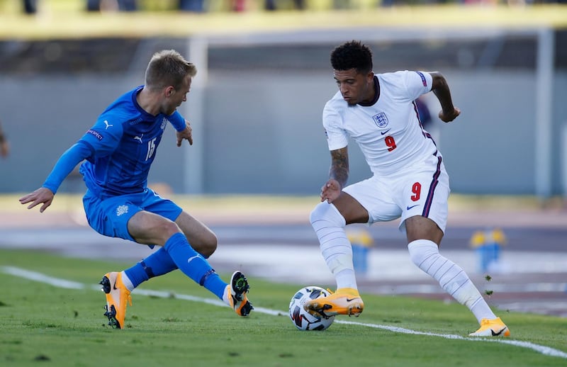 England's Jadon Sancho takes on Jon Dagur Thorsteinsson of Iceland. Reuters