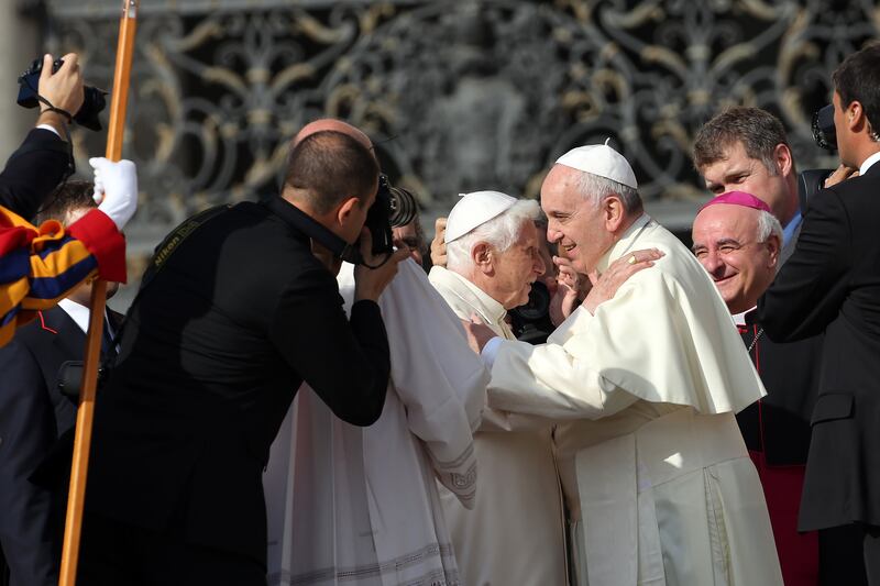 Pope Francis greets Pope Emeritus Benedict XVI at St Peter's Basilica in September 2014. Getty Images