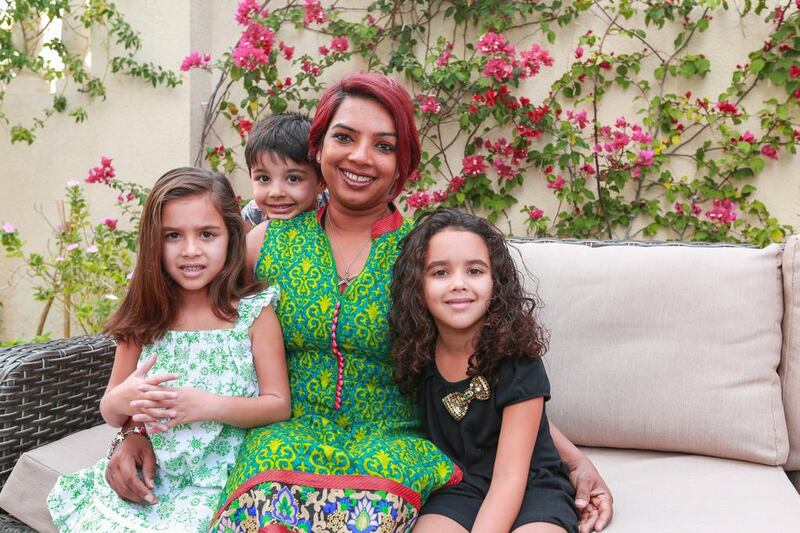 Suman Manning with her triplets, from left, Zoe, Zandar and Zara, at their Mirdif home in Dubai. Victor Besa for The National