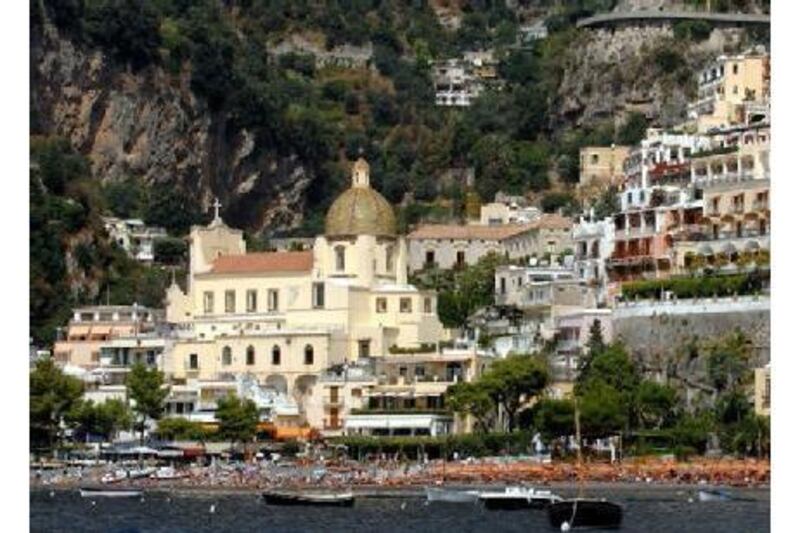 The town of Positano is built on the sides of a steep gorge, creating the impression of buildings stacked on top of each other.