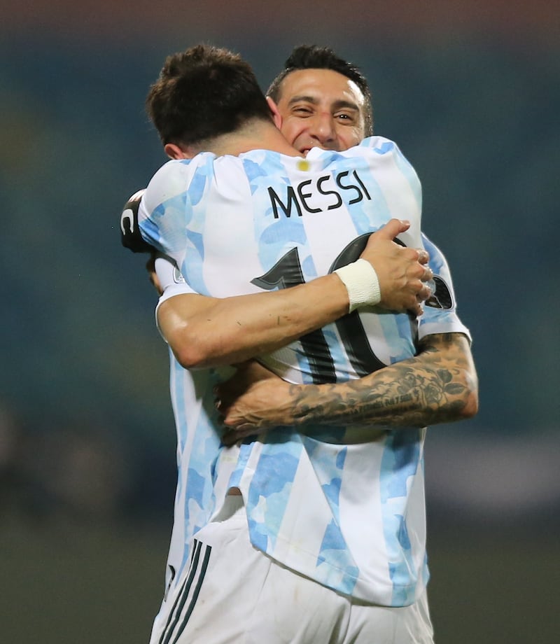 Lionel Messi celebrates with Angel Di Maria after the match.