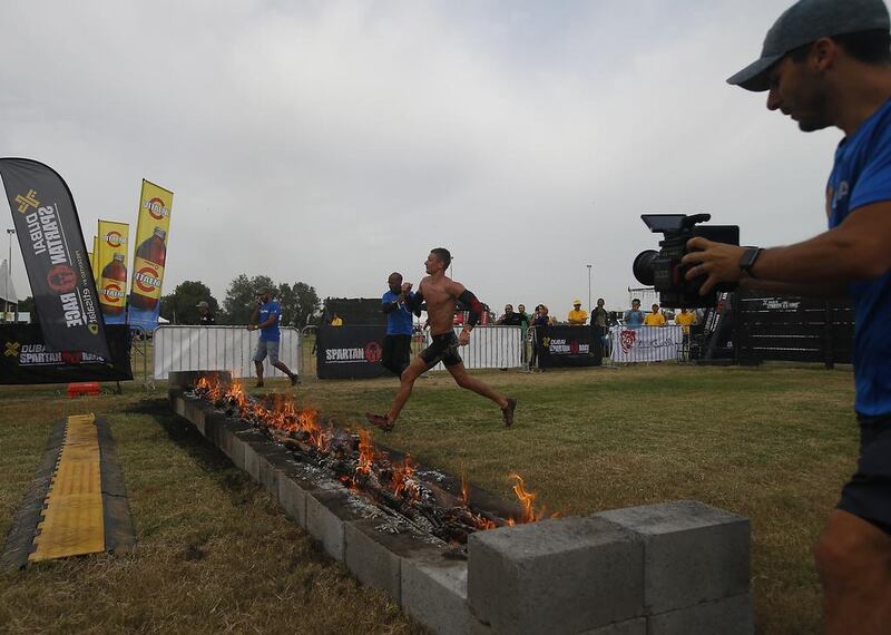 Elite super participant Sercey Perelygin from Russia heads toward the finish line and a first place finish in the XDubai Spartan Race at Al Ghazal Golf Club in Abu Dhabi. Ravindranath K / The National / February 24, 2017