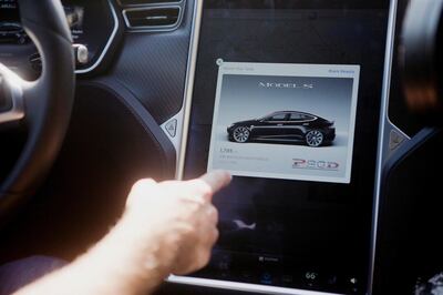 FILE PHOTO: The Tesla Model S version 7.0 software update containing Autopilot features is demonstrated during a Tesla event in Palo Alto, California, U.S., October 14, 2015. REUTERS/Beck Diefenbach/File Photo