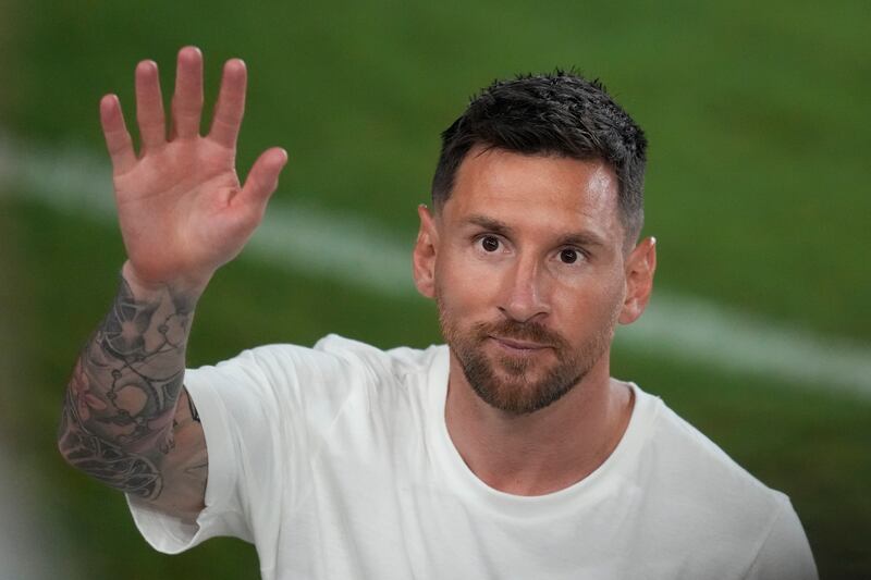  Lionel Messi greets the crowd. AP