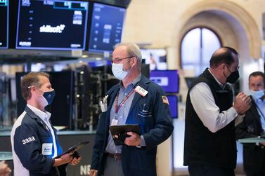 Traders work on the floor of the New York Stock Exchange. Global equity funds received a net $10.3 billion in the week ended June 16, compared with about $13bn outflows in the previous week. Photo: AP