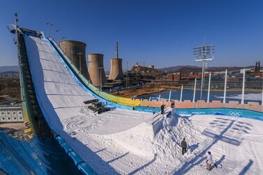 BEIJING, CHINA - JANUARY 29: Members of the staff build the kicker at the Big Air Shougang ahead of the Beijing Winter Olympics on January 29, 2022 in Beijing, China. (Photo by David Ramos / Getty Images)