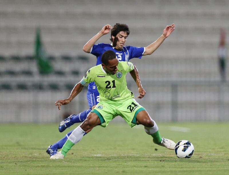  Dubai United Arab Emirates- May,15, 2013:  Al Shabab (UAE - green )  and (L)  Esteghlal (Iran - blue) in action during the AFC Championships League match at  the Al Shabab Stadium in Dubai.  ( Al Ittihad ) 

 