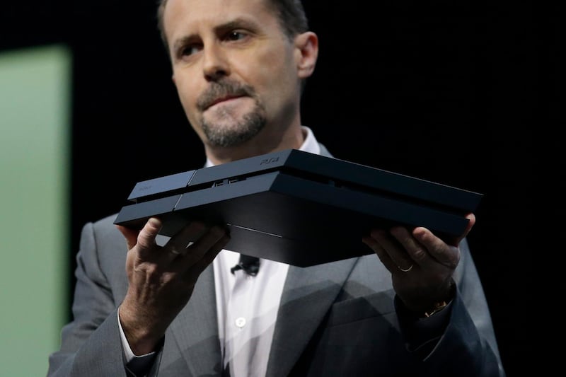 Sony Computer Entertainment president and CEO Andrew House introduces the new PlayStation 4 at the Sony PlayStation E3 media briefing in Los Angeles, Monday, June 10, 2013. Sony is giving gamers their first look at the PlayStation 4 and it's a rectangular black box, just like all the previous PlayStations. (AP Photo/Jae C. Hong) *** Local Caption ***  Games E3 Sony.JPEG-0e107.jpg