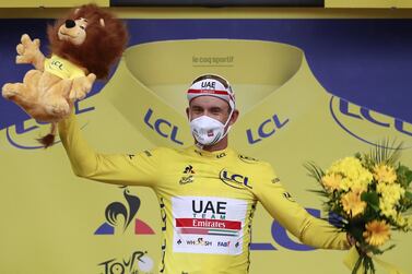 epa08634137 Norwegian rider Alexander Kristoff of the UAE-Team Emirates celebrates on the podium wearing the overall leader's yellow jersey after winning the first stage of the Tour de France over 156km in Nice, France, 29 August 2020. EPA/Christophe Petit-Tesson / Pool