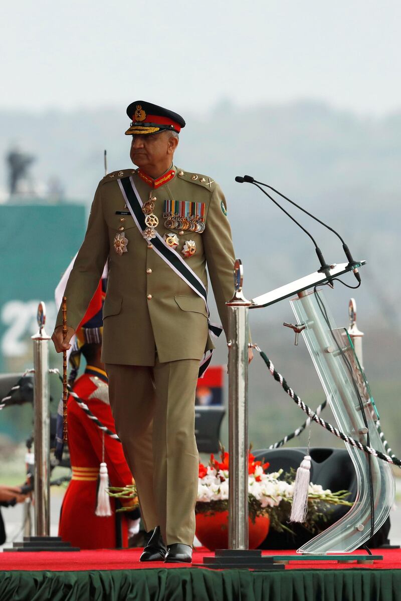 FILE PHOTO: Pakistan's Army Chief of Staff General Qamar Javed Bajwa, walks as he arrives to attend the Pakistan Day military parade in Islamabad, Pakistan March 23, 2019. Picture taken March 23, 2019. REUTERS/Akhtar Soomro/File Photo