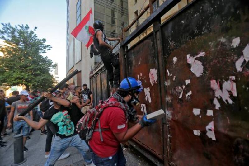 Lebanese protesters attempt to break into parliament as members of the security forces clash with demonstrators in Downtown Beirut.