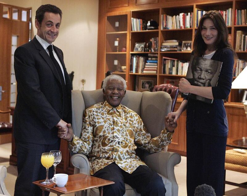 France’s former president Nicolas Sarkozy and his wife Carla Bruni-Sarkozy with Mandela during their visit to the Mandela Foundation in Johannesburg on February 29, 2008. Remy de la Mauviniere / Reuters